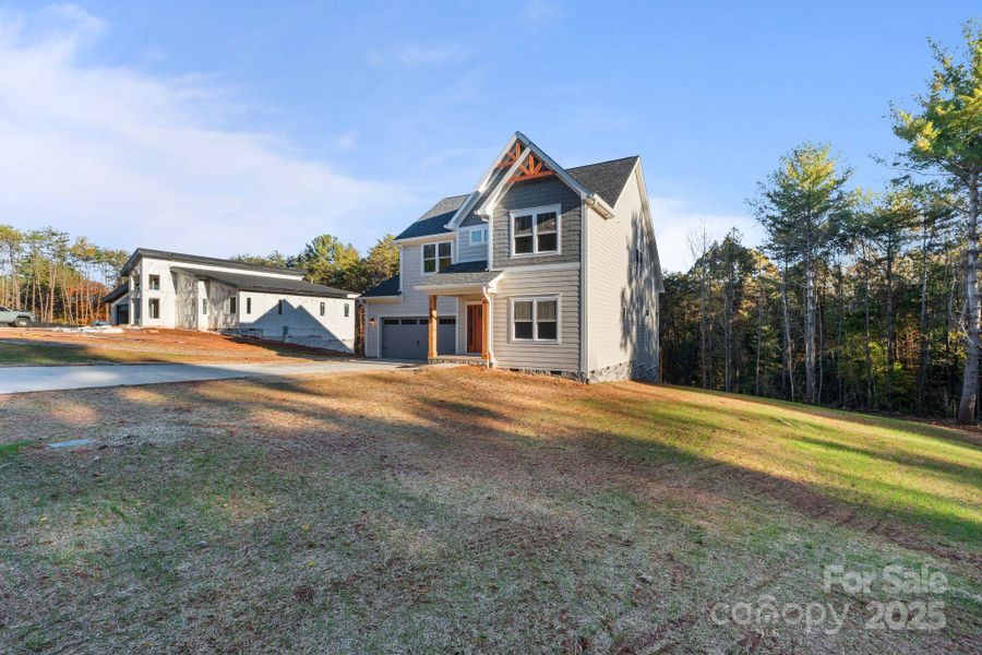 Front exterior of a new home in , Hickory, NC, highlighting curb appeal (Image 26).