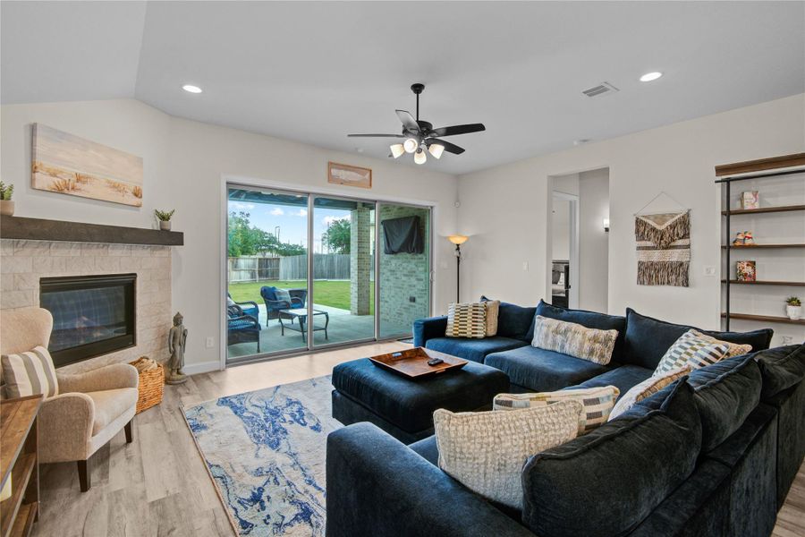 Family Room overlooking the Covered Patio - Expansive Sliding Patio Doors open to connect the family room to the outdoor space Family Room overlooking the Covered Patio - Expansive Sliding Patio Doors open to connect the family room to the outdoor space