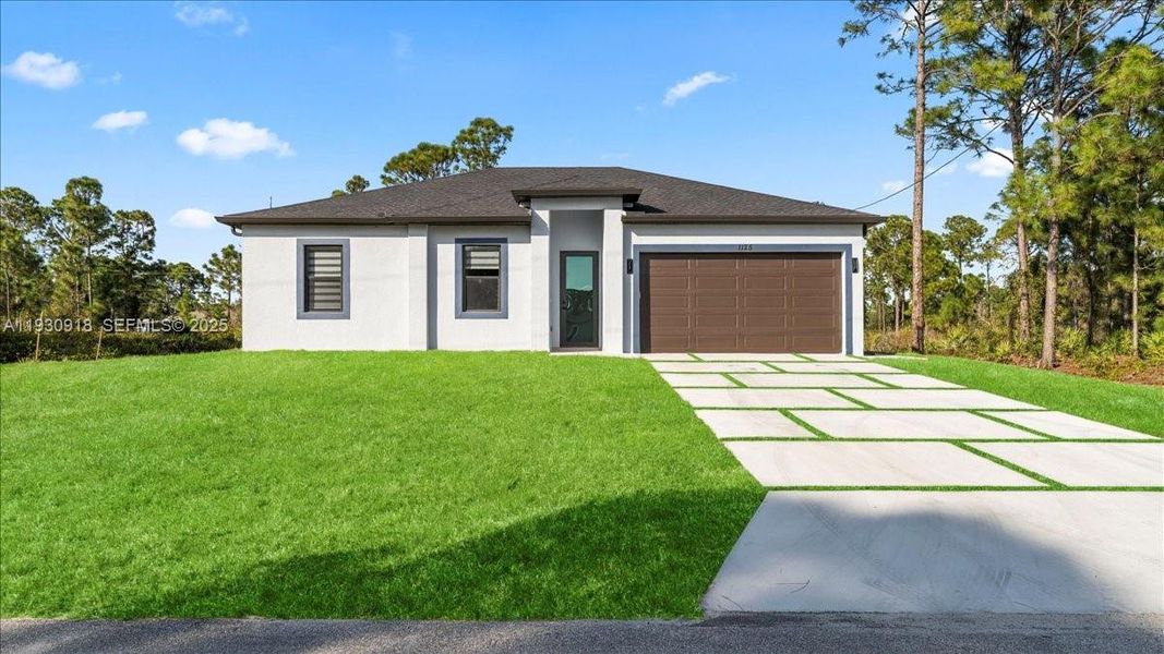 Front exterior of a new home in , Lehigh Acres, FL, highlighting curb appeal (Image 23). Front exterior of a new home in , Lehigh Acres, FL, highlighting curb appeal (Image 23).