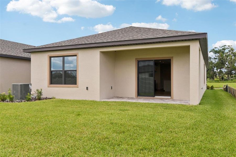 Front exterior of a new home in Grasslands West, Lakeland, FL, highlighting curb appeal (Image 14). Front exterior of a new home in Grasslands West, Lakeland, FL, highlighting curb appeal (Image 14).
