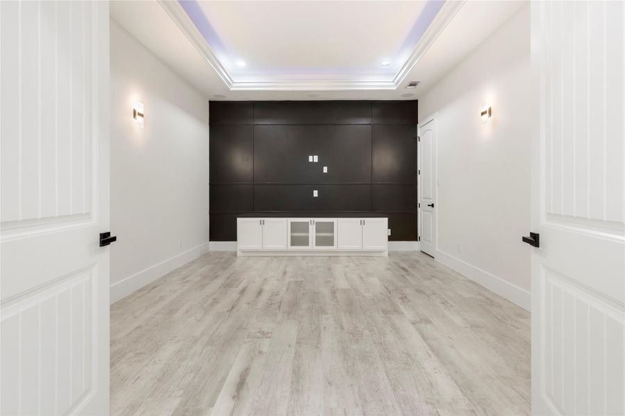 This media room comes complete with wall sconces, LED lights in the tray ceiling. The owner had it wired after closing for surround sound and added speakers. The media cabinet and media closet help keep all the equipment tucked out of sight. Wood doors allow the people watching movies to experience it without the whole house having to experience the movies you are watching. This media room comes complete with wall sconces, LED lights in the tray ceiling. The owner had it wired after closing for surround sound and added speakers. The media cabinet and media closet help keep all the equipment tucked out of sight. Wood doors allow the people watching movies to experience it without the whole house having to experience the movies you are watching.