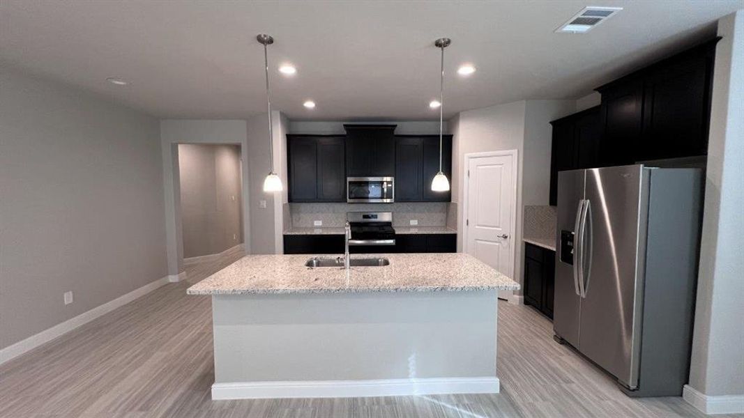 Kitchen-All Home and community information, including pricing, included features, terms, availability and amenities, are subject to change at any time without notice or obligation. All Drawings, pictures, photographs, video, square footages, floor plans, elevations, features, colors and sizes are approximate for illustration purposes only and will vary from the homes as built.