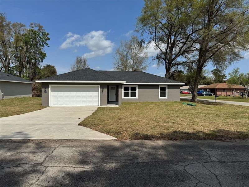 Front exterior of a new home in , Summerfield, FL, highlighting curb appeal (Image 1). Front exterior of a new home in , Summerfield, FL, highlighting curb appeal (Image 1).