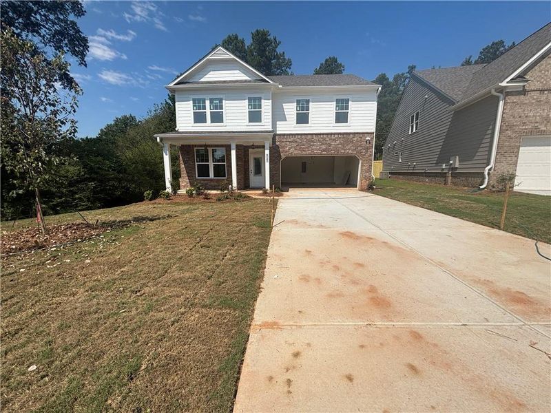 Front exterior of a new home in Edenglen, Buford, GA, highlighting curb appeal (Image 5).