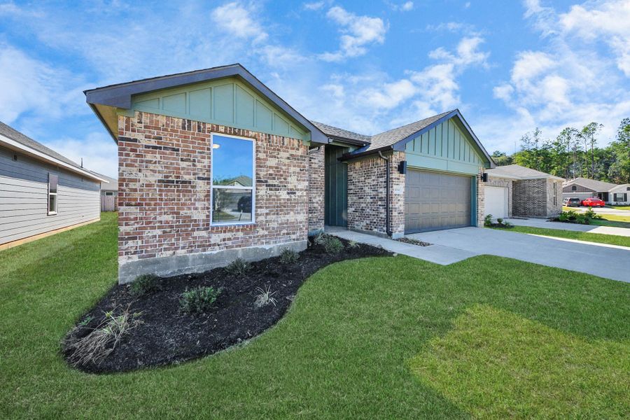 Front exterior of a new home in Grand Oaks Reserve, Cleveland, TX, highlighting curb appeal (Image 26). Front exterior of a new home in Grand Oaks Reserve, Cleveland, TX, highlighting curb appeal (Image 26).