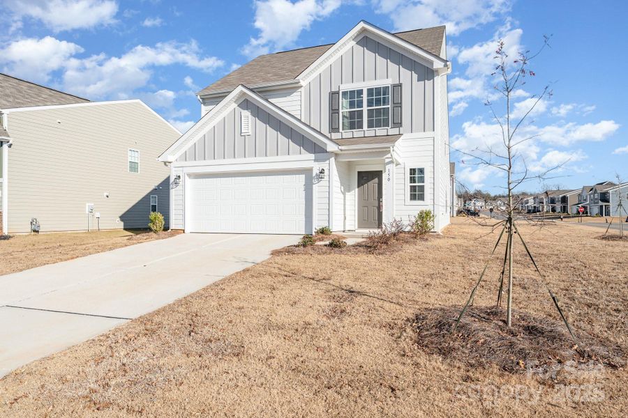 Front exterior of a new home in Sullivan Farm, Statesville, NC, highlighting curb appeal (Image 22). Front exterior of a new home in Sullivan Farm, Statesville, NC, highlighting curb appeal (Image 22).
