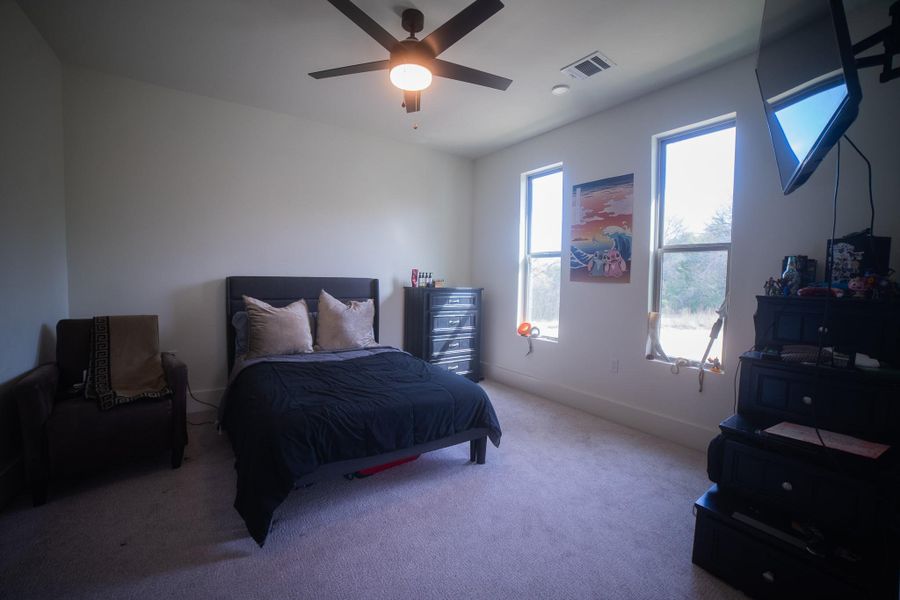 This exceptional junior suite (bedroom 2) offers guests or family members the ultimate in privacy and comfort. Featuring oversized windows for a bright, cheerful atmosphere, the room is complete with a spacious walk-in closet and its own private full ensuite, providing a luxury hotel-like experience