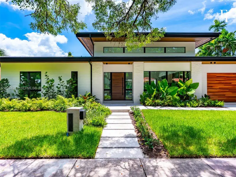 Front exterior of a new home in , Coral Gables, FL, highlighting curb appeal (Image 1). Front exterior of a new home in , Coral Gables, FL, highlighting curb appeal (Image 1).