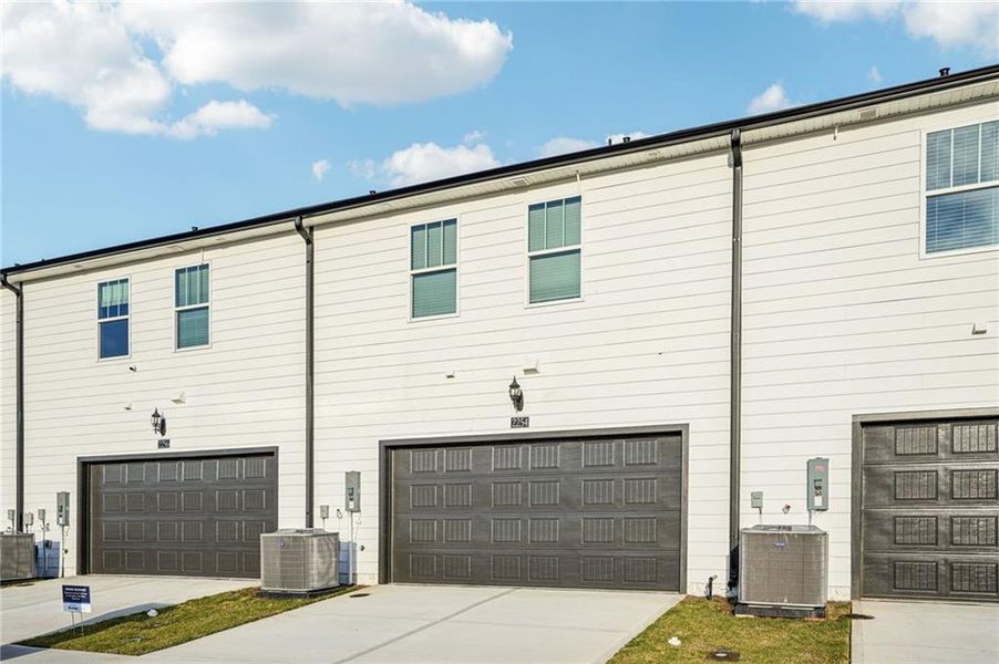 Front exterior of a new home in , Conyers, GA, highlighting curb appeal (Image 1).