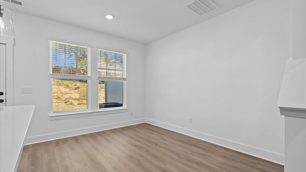 Memorable meals start in this exclusive dining space featuring elegant trim and natural light