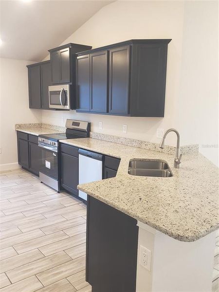 Furnished interior view inside a new home in Pine Bluff, Spring Hill (Image 4). Furnished interior view inside a new home in Pine Bluff, Spring Hill (Image 4).