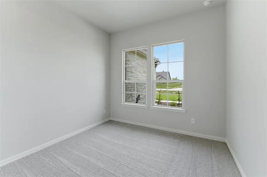 This room features light-colored walls and carpeted flooring