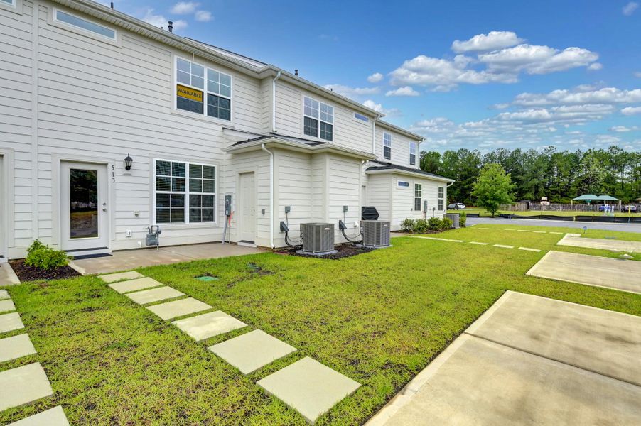 Exterior details and patio area of a home in Lake Carolina Townhomes, Columbia (Image 4).