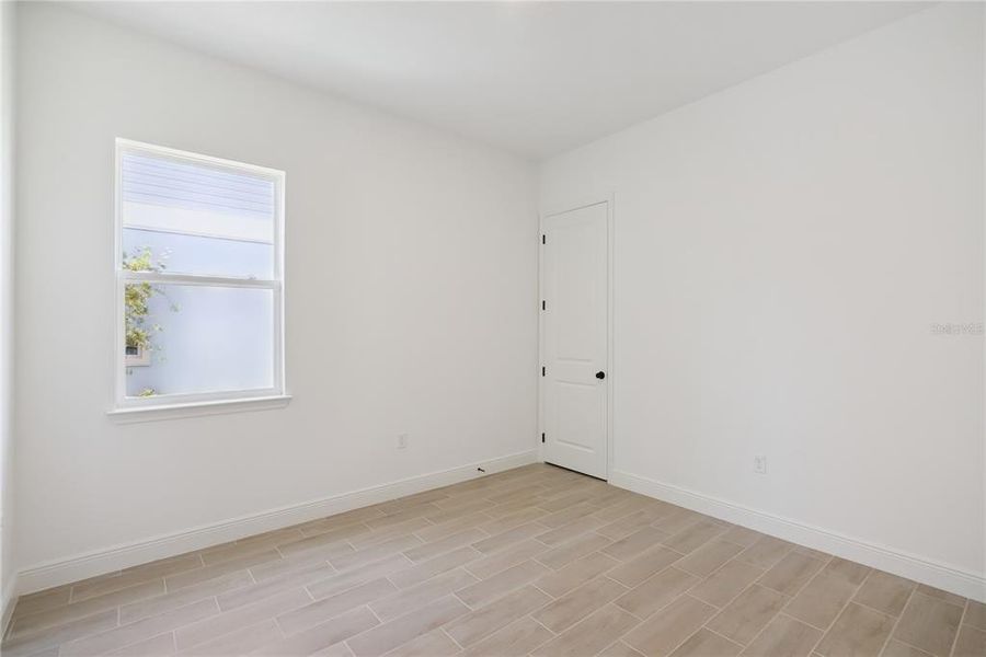 Spacious, unfurnished interior of a new home in Laureate Park, Orlando (Image 24).