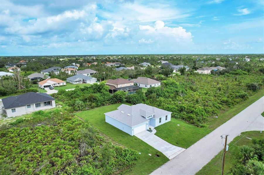 Front exterior of a new home in , Port Charlotte, FL, highlighting curb appeal (Image 1).