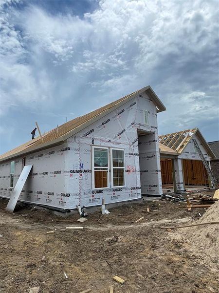 Front exterior of a new home in Sierra Vista, Rosharon, TX, highlighting curb appeal (Image 3).