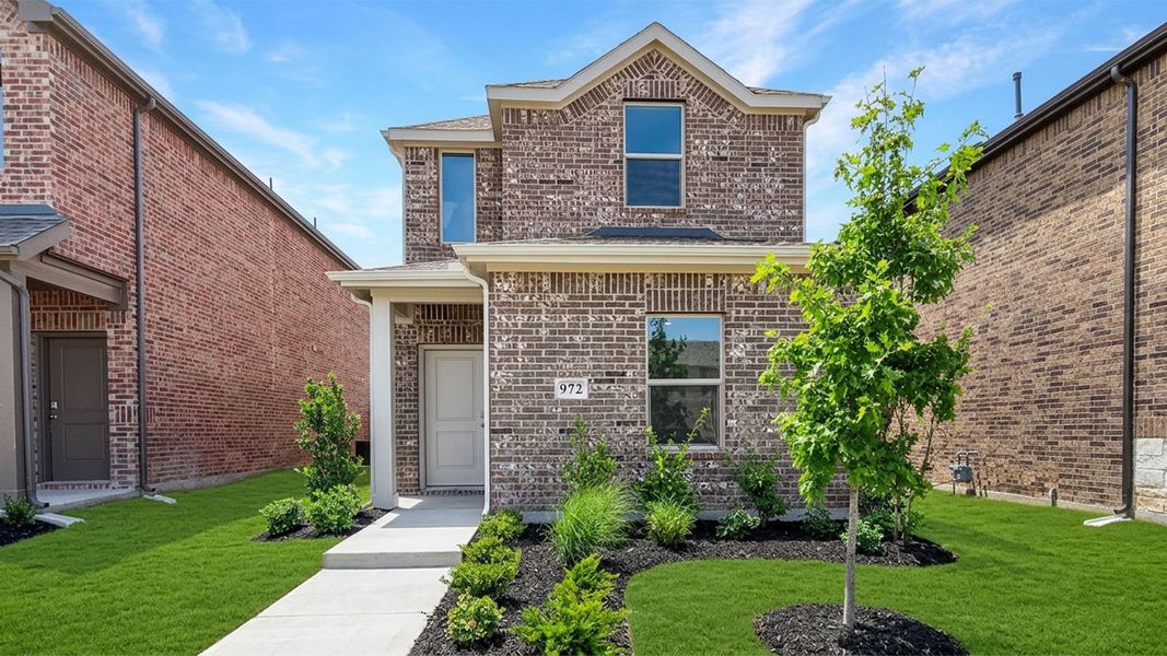 Front exterior of a new home in Elevon, Lavon, TX, highlighting curb appeal (Image 1). Front exterior of a new home in Elevon, Lavon, TX, highlighting curb appeal (Image 1).