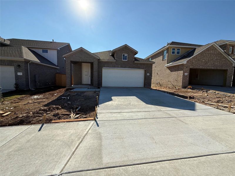 Front exterior of a new home in The Cottages at La Cima, San Marcos, TX, highlighting curb appeal (Image 2).