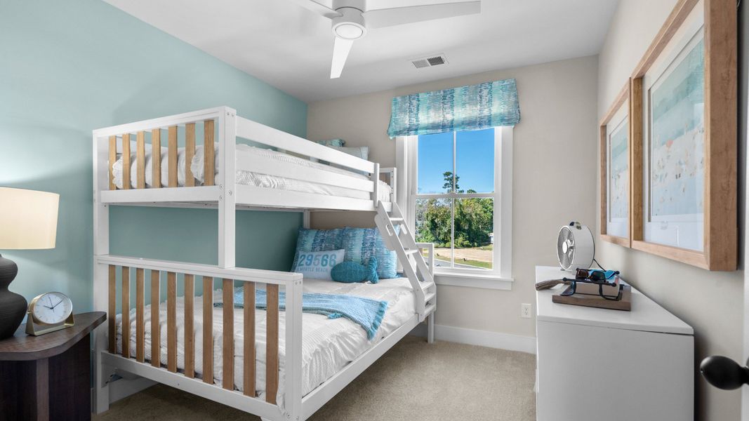 The Brookgreen secondary bedroom at Seabreeze blends comfort, function, and coastal charm.