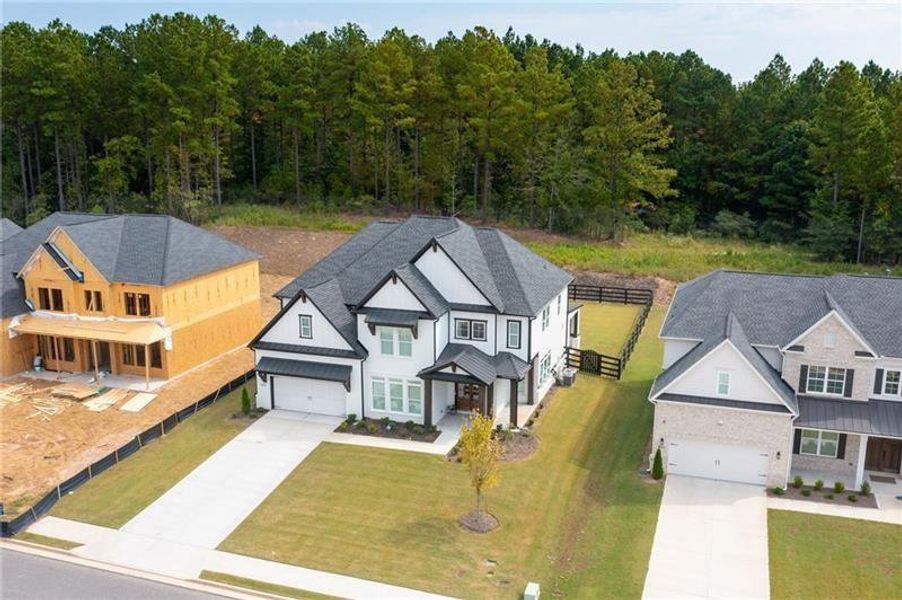 Front exterior of a new home in , Woodstock, GA, highlighting curb appeal (Image 26).