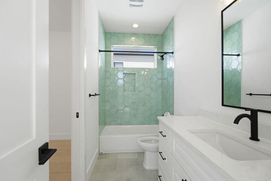 Bathroom featuring vanity and tub / shower combination