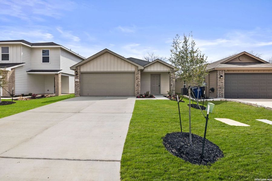 Front exterior of a new home in Spring Valley, New Braunfels, TX, highlighting curb appeal (Image 1). Front exterior of a new home in Spring Valley, New Braunfels, TX, highlighting curb appeal (Image 1).