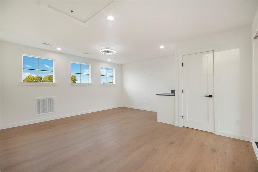 Spare room with recessed lighting and light wood-type flooring