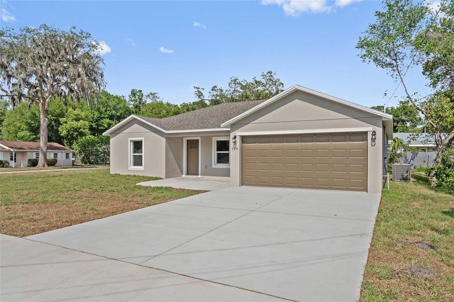 Front exterior of a new home in , Orange City, FL, highlighting curb appeal (Image 26).