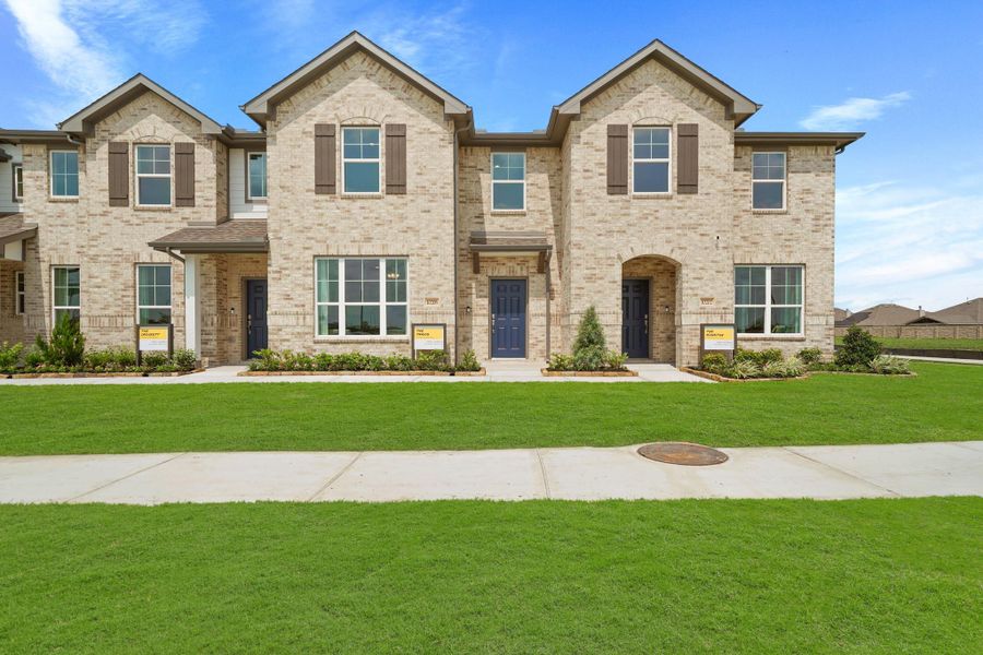 Front exterior of a new home in Sierra Vista Townhomes, Rosharon, TX, highlighting curb appeal (Image 17). Front exterior of a new home in Sierra Vista Townhomes, Rosharon, TX, highlighting curb appeal (Image 17).