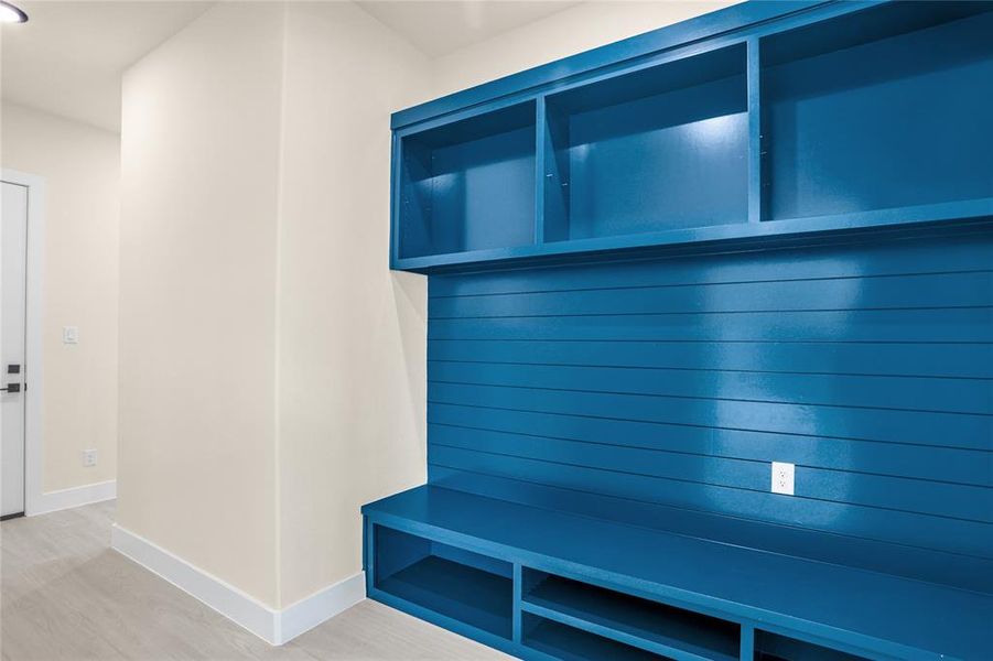 Mudroom featuring baseboards and light wood-type flooring Mudroom featuring baseboards and light wood-type flooring