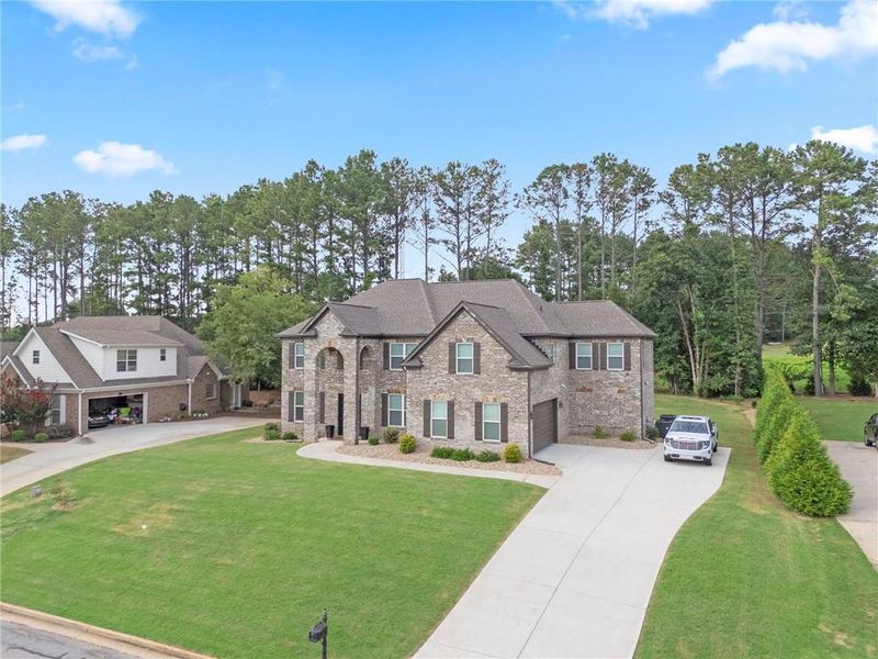 Front exterior of a new home in , Conyers, GA, highlighting curb appeal (Image 25).