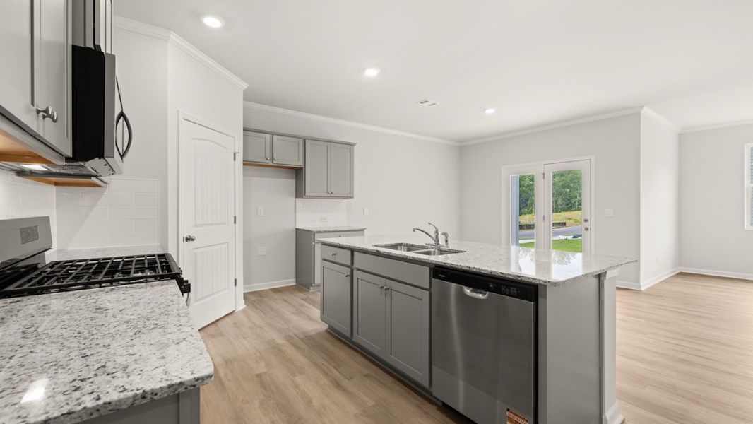 Representative furnished interior of a home built from the Cali by D.R. Horton in Sheffield Highlands, Dallas (Image 6).