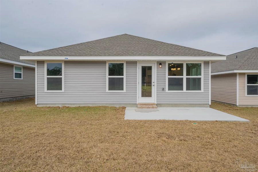 Exterior details and patio area of a home in Westpointe Place, Pensacola (Image 1).