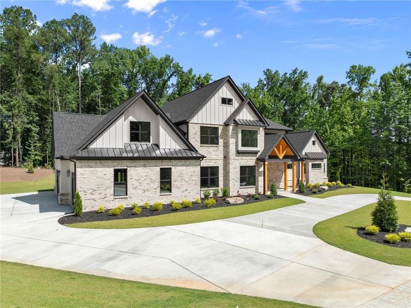 Front exterior of a new home in , Hoschton, GA, highlighting curb appeal (Image 26).