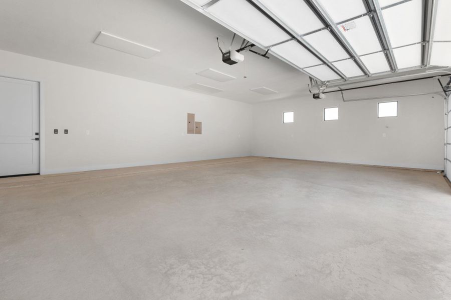 Oversized 3-car garage with 8' insulated garage doors & Wi-fi garage door openers Oversized 3-car garage with 8' insulated garage doors & Wi-fi garage door openers