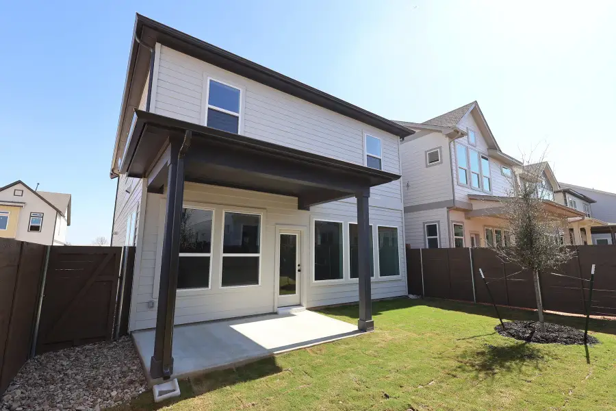 Exterior details and patio area of a home in Double Creek Crossing – Quick Move-in Homes - Craftsman, Round Rock (Image 3).