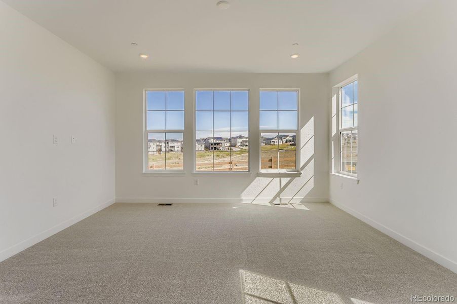 Spacious, unfurnished interior of a new home in Sunset Village: The Grand Collection, Erie (Image 10).