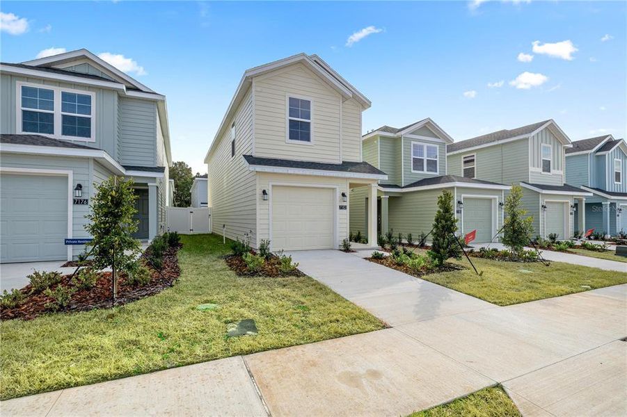 Front exterior of a new home in , Ocala, FL, highlighting curb appeal (Image 2). Front exterior of a new home in , Ocala, FL, highlighting curb appeal (Image 2).