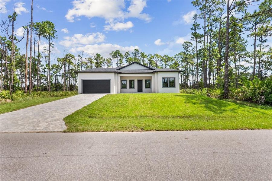 Front exterior of a new home in , Port Charlotte, FL, highlighting curb appeal (Image 30). Front exterior of a new home in , Port Charlotte, FL, highlighting curb appeal (Image 30).