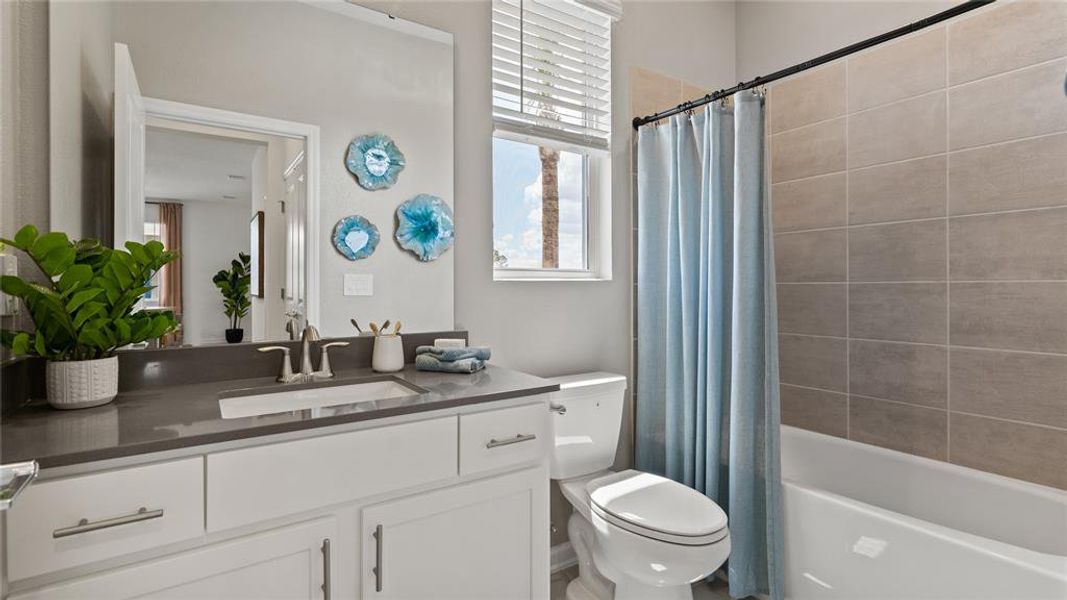 Full bath with vanity and shower / bath combination with curtain Full bath with vanity and shower / bath combination with curtain