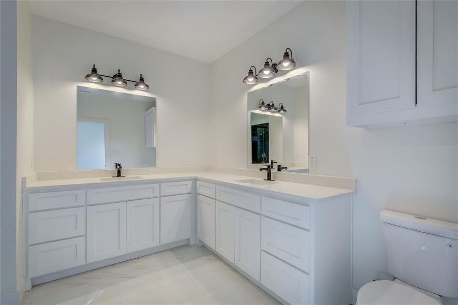 Full bath with double vanity and toilet Full bath with double vanity and toilet