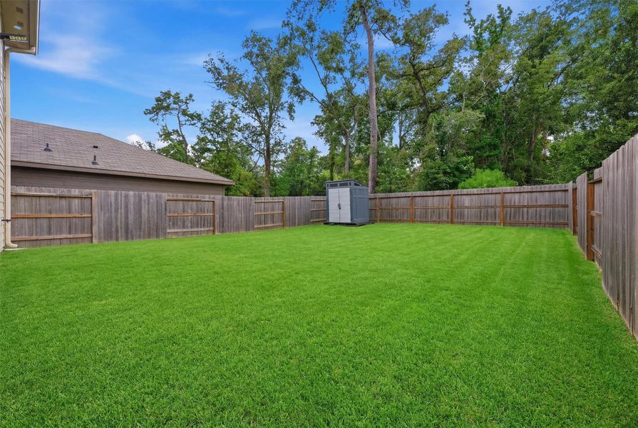 Exterior details and patio area of a home in Pinewood at Grand Texas, New Caney (Image 23).