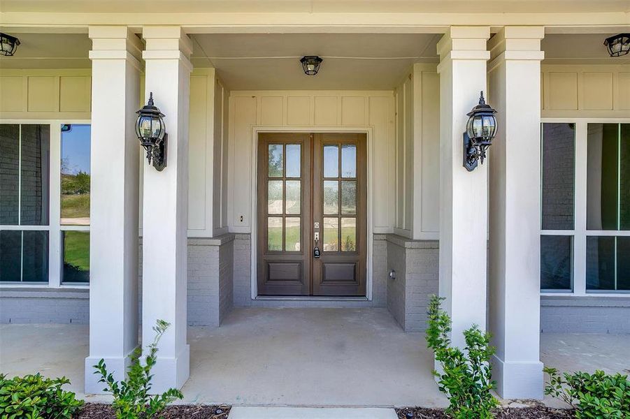 Entrance to property with a porch