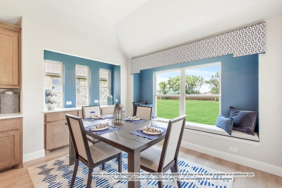Dining area with dark wood table, window seat, blue accent walls, and large windows overlooking a backyard Dining area with dark wood table, window seat, blue accent walls, and large windows overlooking a backyard