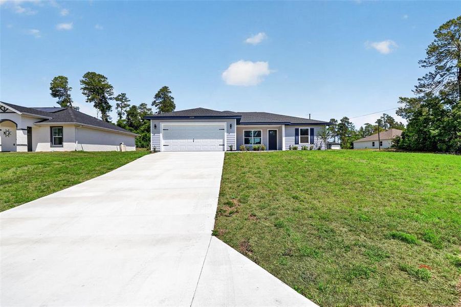 Front exterior of a new home in , Dunnellon, FL, highlighting curb appeal (Image 25).