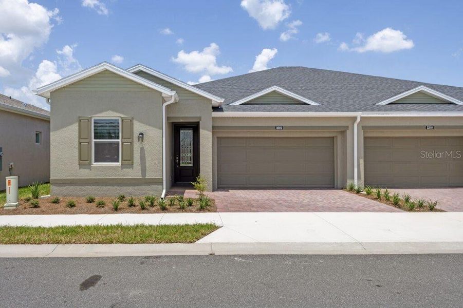 Front exterior of a new home in , Ocala, FL, highlighting curb appeal (Image 1).