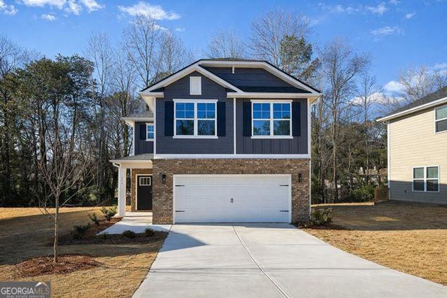 Front exterior of a new home in Canterbury Villas, Carrollton, GA, highlighting curb appeal (Image 1). Front exterior of a new home in Canterbury Villas, Carrollton, GA, highlighting curb appeal (Image 1).
