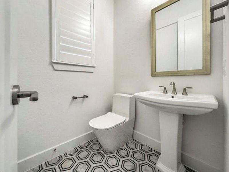 Bathroom featuring baseboards and tile patterned flooring Bathroom featuring baseboards and tile patterned flooring