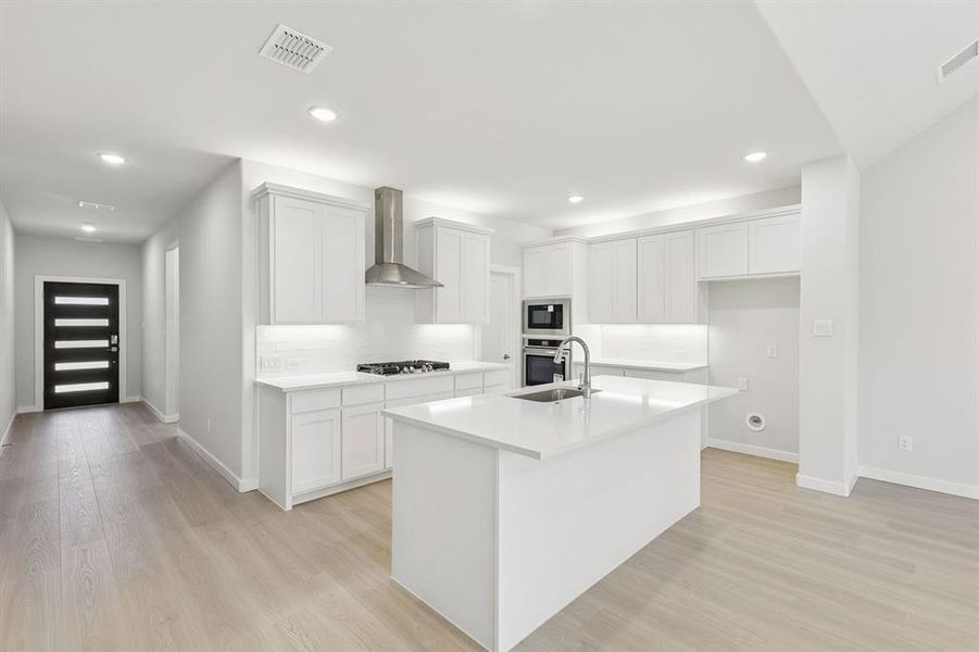 Kitchen in the Masters home plan by Trophy Signature Homes – REPRESENTATIVE PHOTO