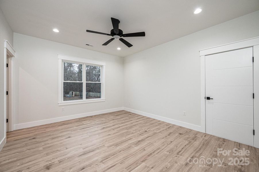 Bedroom #4 with Large Walk in Closet and Ceiling Fan, Upstairs, Back Right, Walk in Attic Access. Large Floored Attic Storage Space. Bedroom #4 with Large Walk in Closet and Ceiling Fan, Upstairs, Back Right, Walk in Attic Access. Large Floored Attic Storage Space.